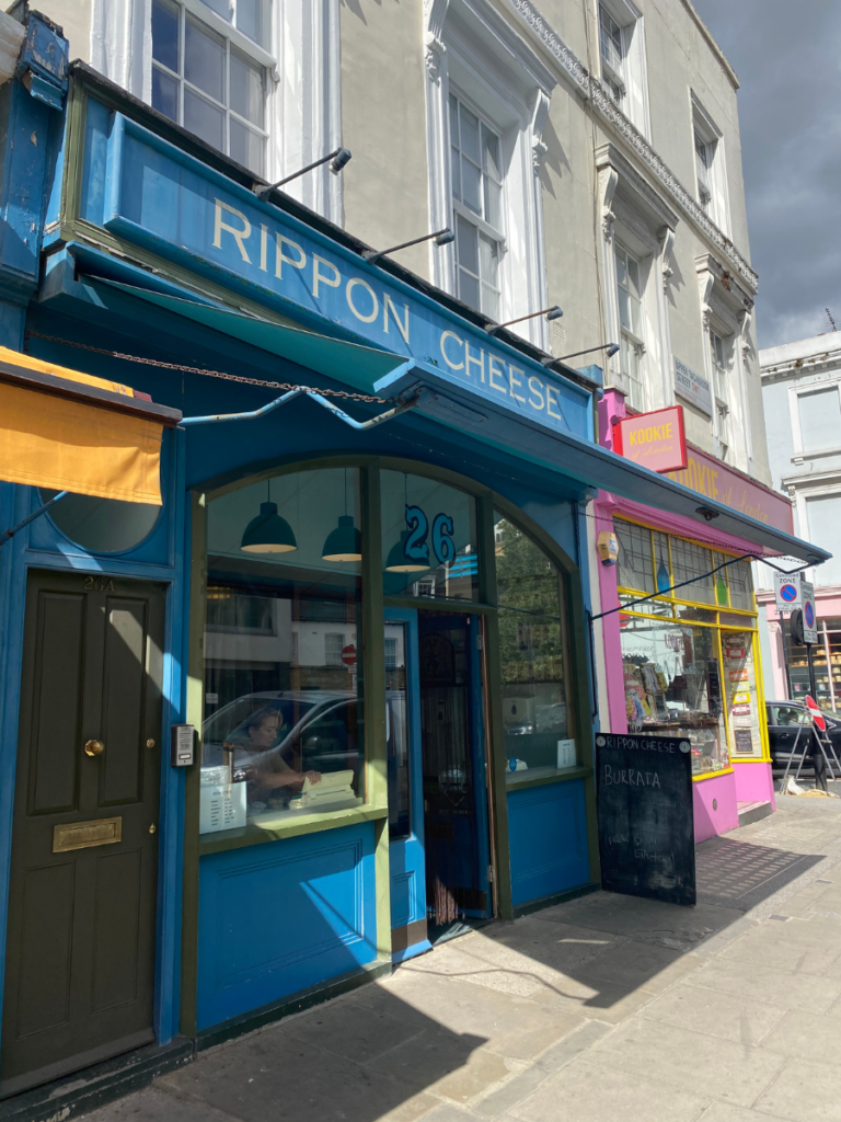 The blue exterior of Rippon Cheese in Pimlico