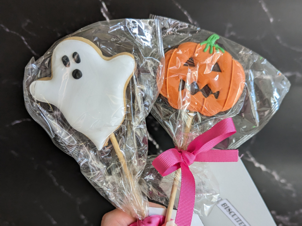 biscuiteers white ghost biscuit pop and orange pumpkin biscuit pop
