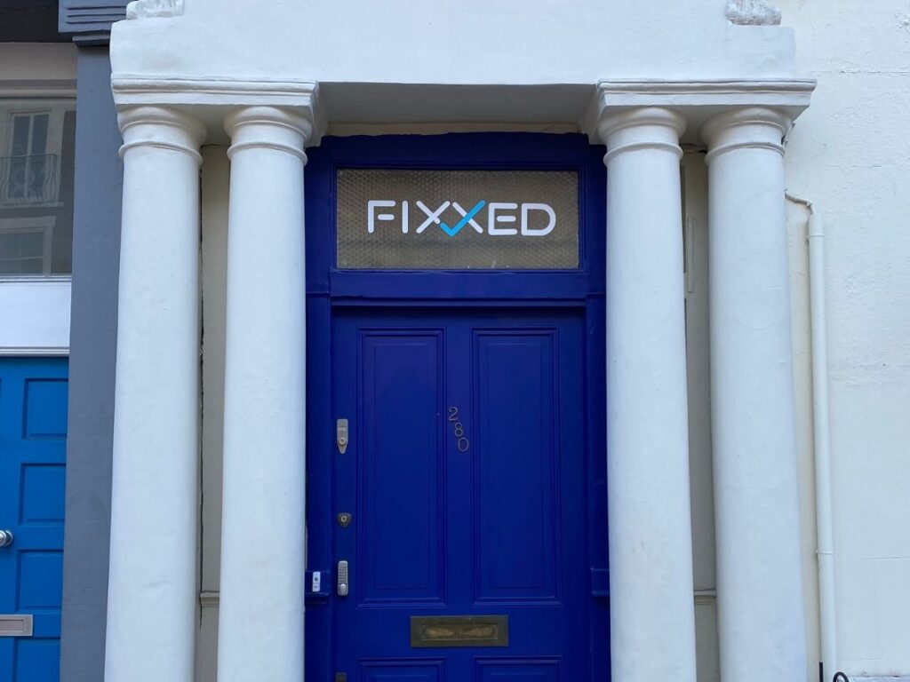 The outside of William Thacker's flat in Notting Hill with its iconic blue front door