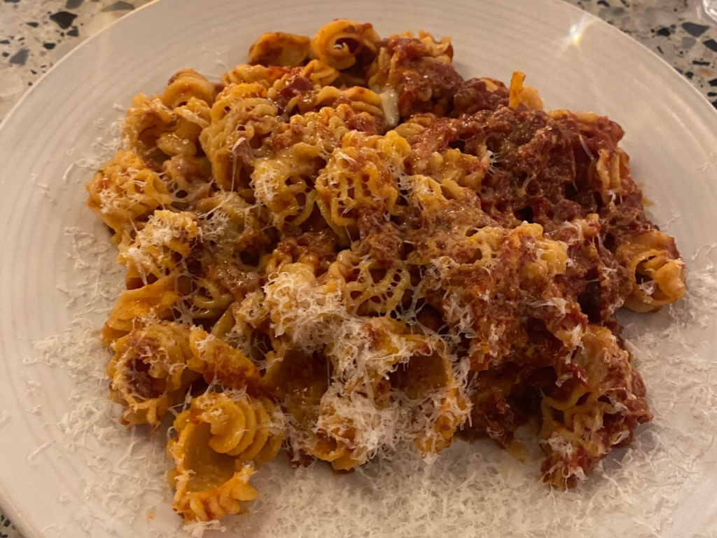 slow cooked tomato sauce on pasta with parmesan