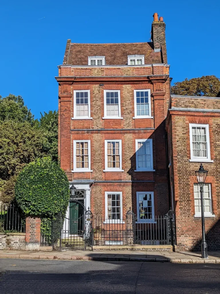 A tall four story red brick house in Hampstead, London