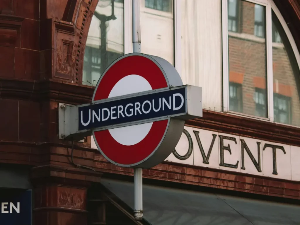 Covent Garden's red shiny brick tub station with the tube roundel outside