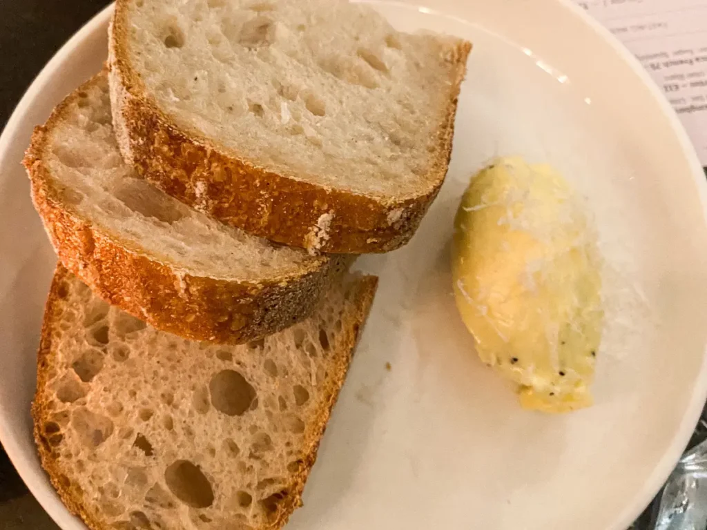 Sourdough bread slices with a curl of butter